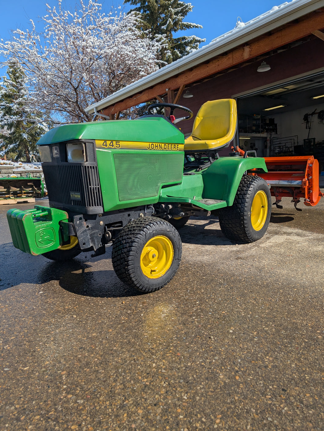 John Deere 445 with rear PTO kit and rototiller