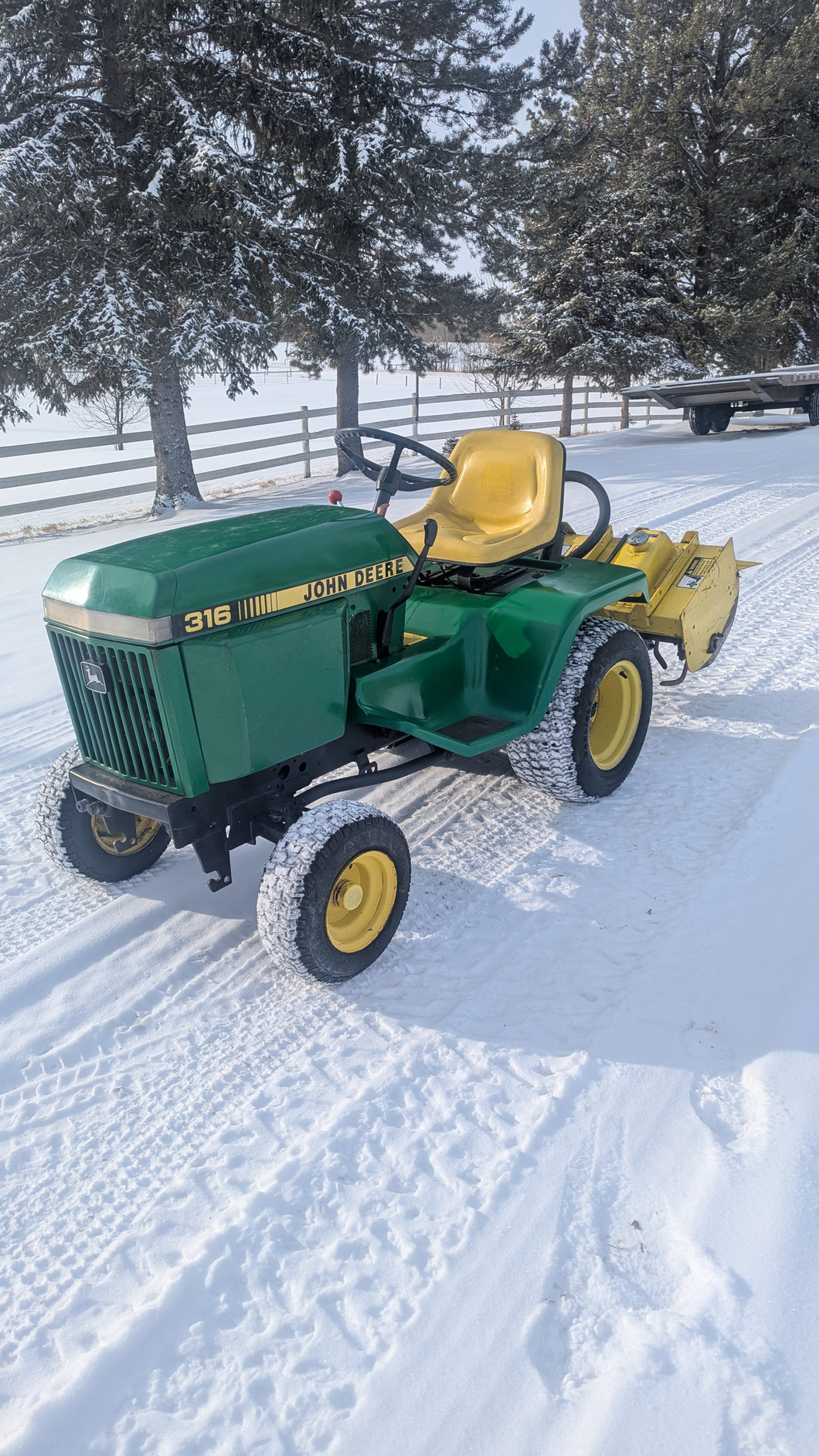 John deere 316 and rototiller