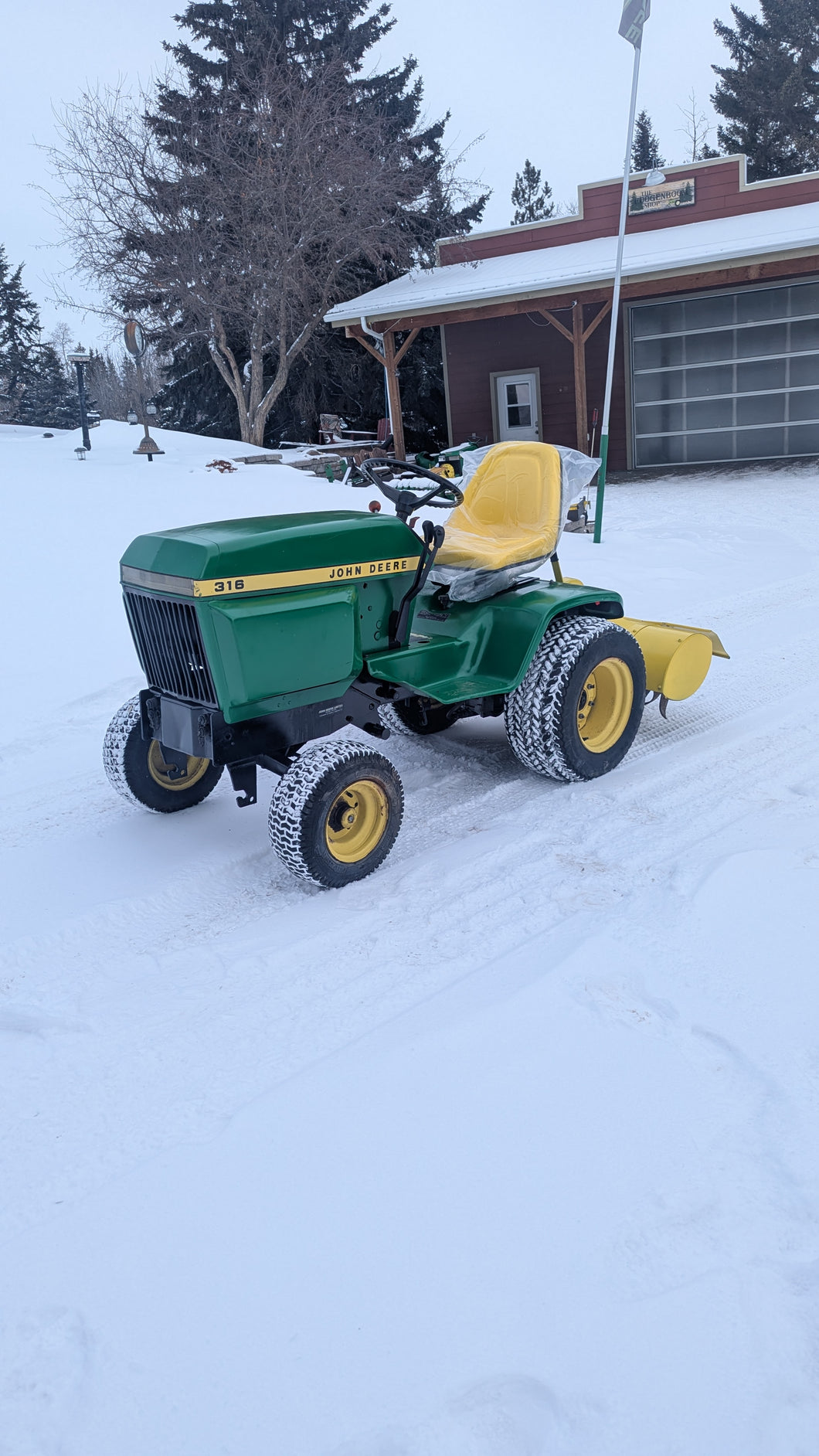 John Deere 316 and Rototiller