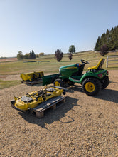Load image into Gallery viewer, John Deere X585 4x4 with front blade and 54&quot; mowing deck
